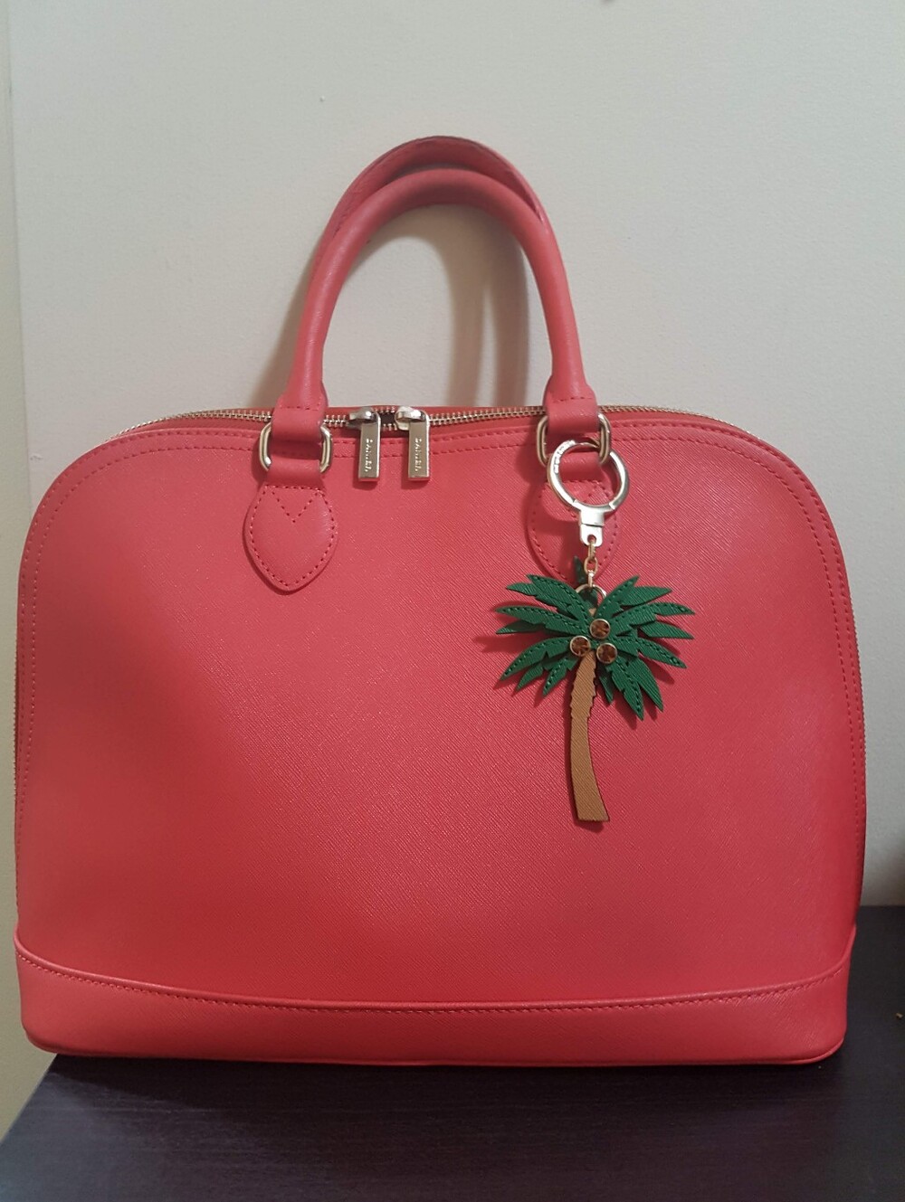 Danier leather handbag in corral - medium size